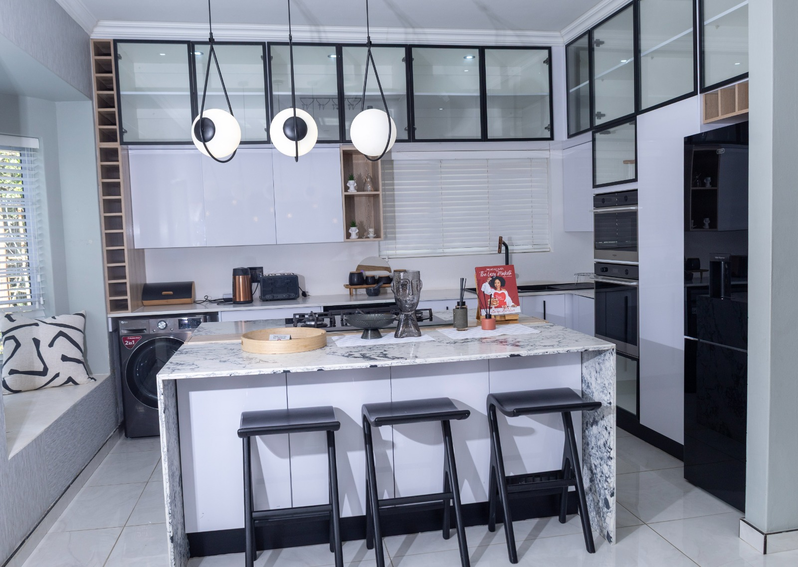 Modern monochrome kitchen at 14 Coralwood Villa in East London